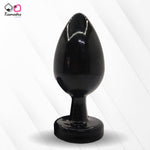 Load image into Gallery viewer, A collection of anal butt plugs in various colors, each featuring a crystal jewel at the base. The plugs are designed in a smooth, egg-shaped form.
